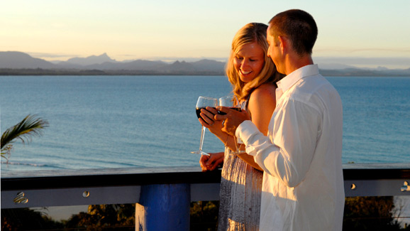 Couple Drinking Wine Overlooking the Ocean