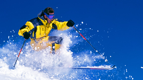Skier in Yellow Onesie