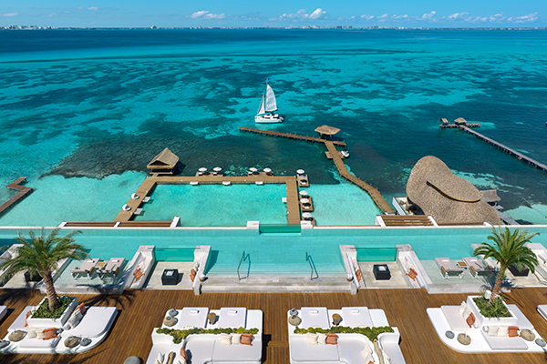 Impression Isla Mujeres by Secrets overview of pool looking over the ocean. 